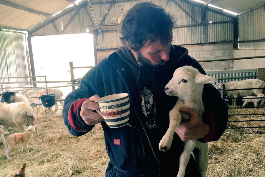Man holding little lamb
