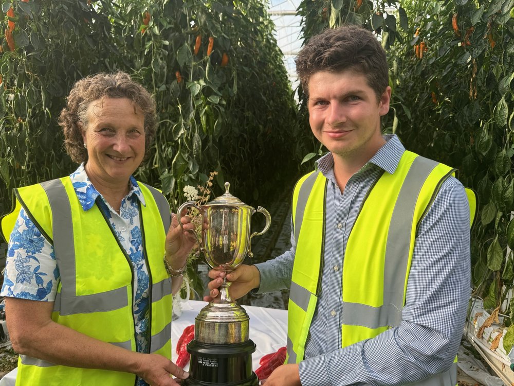 Maz Montgomerie of Court Farm receiving the Emsden trophy from Jack Scott