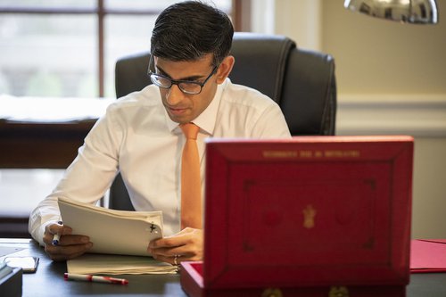 Rishi Sunak with red budget briefcase.jpg